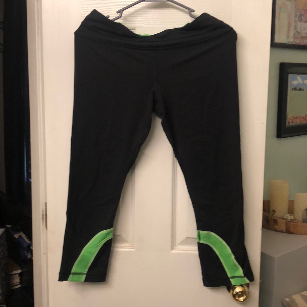 Size 8 Lululemon leggings.  Black and green